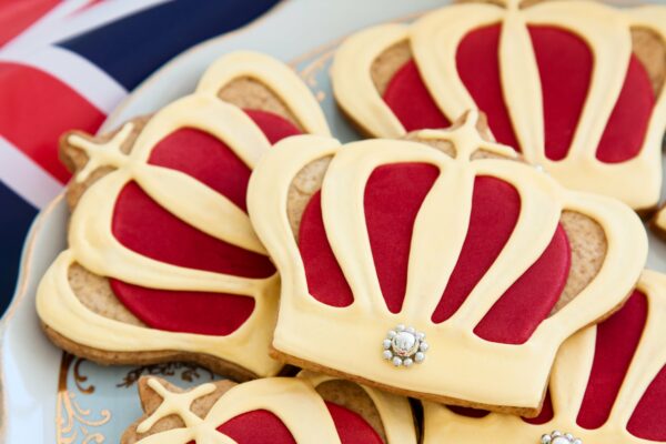 Close up of crown-shaped iced biscuits.