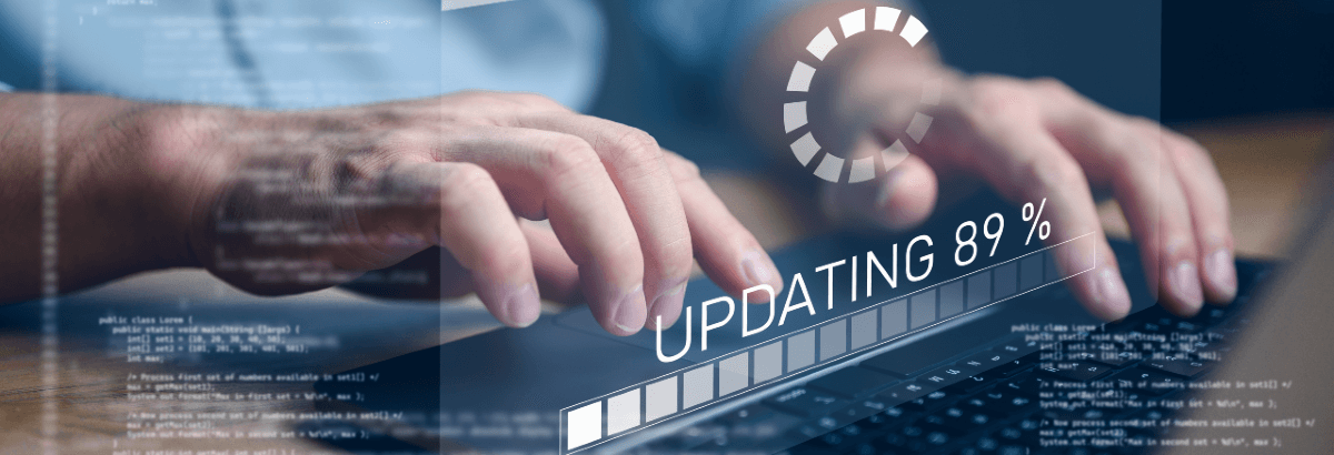 Hands and a keyboard performing a software update