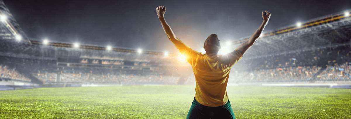 Footballer in stadium at night