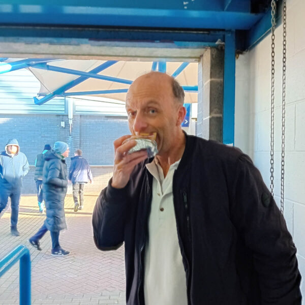 Football Pie Connoisseur Ian Coulton samples the meat and potato pie at Huddersfield Town